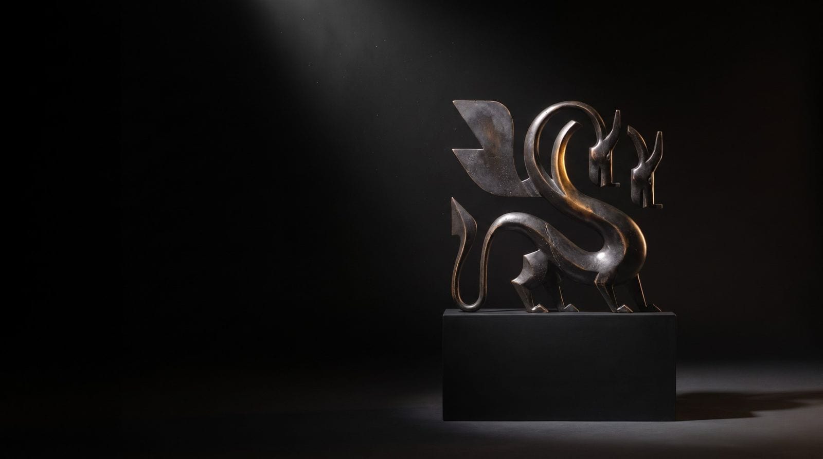 A lion sculpture lit in the studio